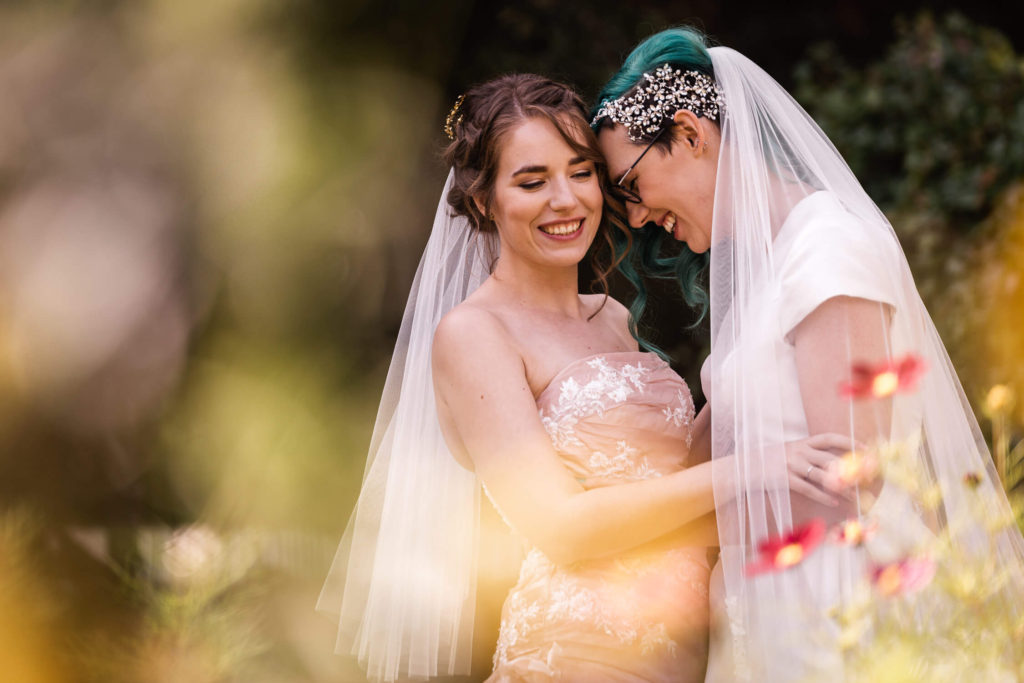 Two brides at Grims Dyke Hotel share moment