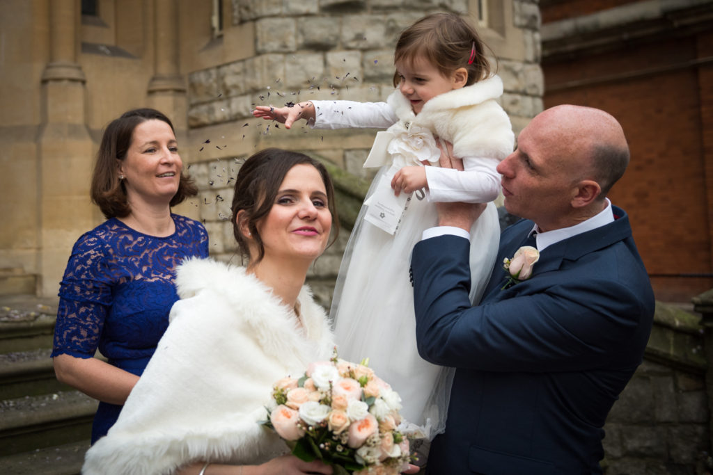daughter thrown confetti on bride